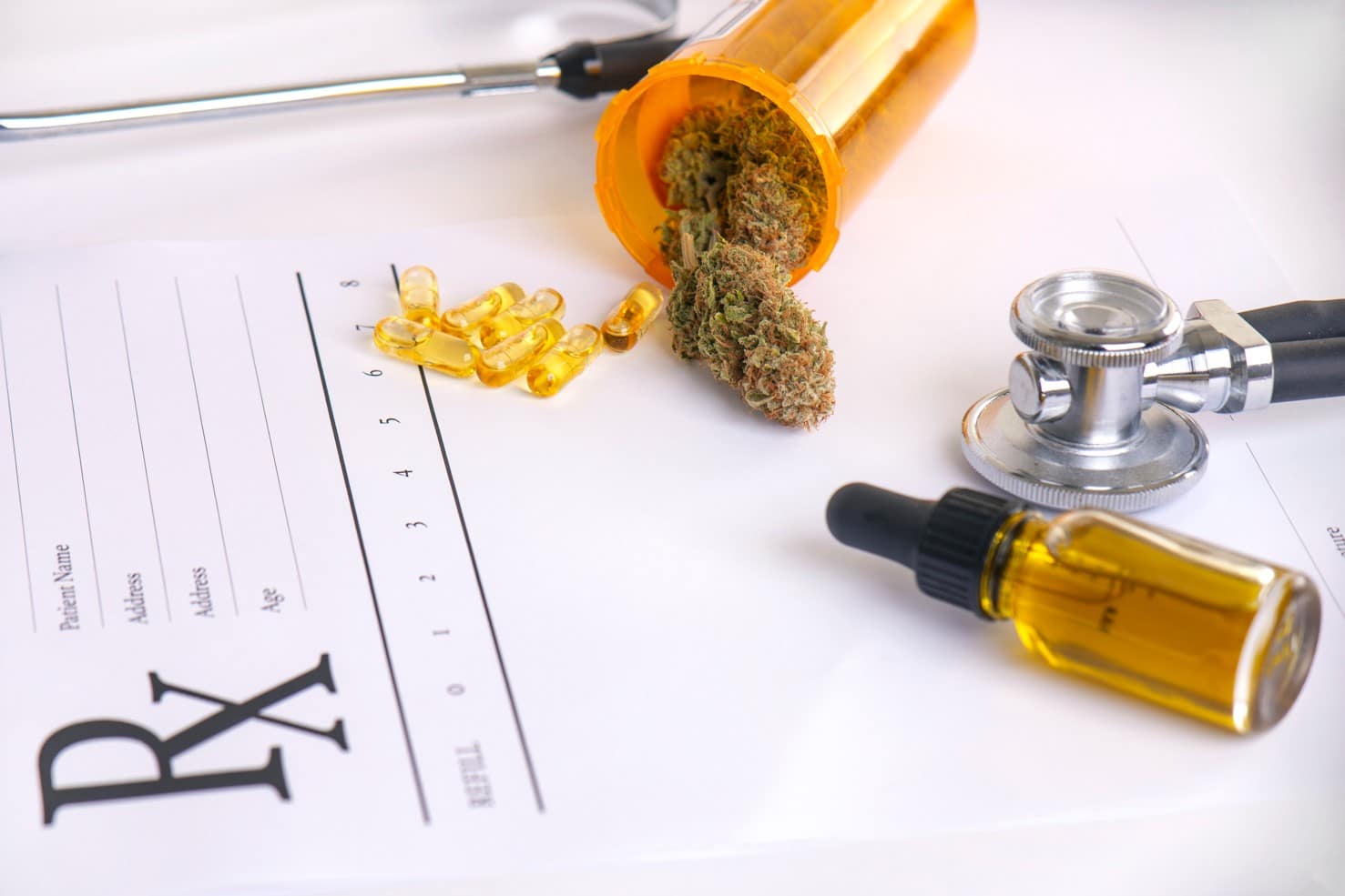 Cannabis products and stethoscope on a medical card showing the benefits of buying marijuana products with a med card.